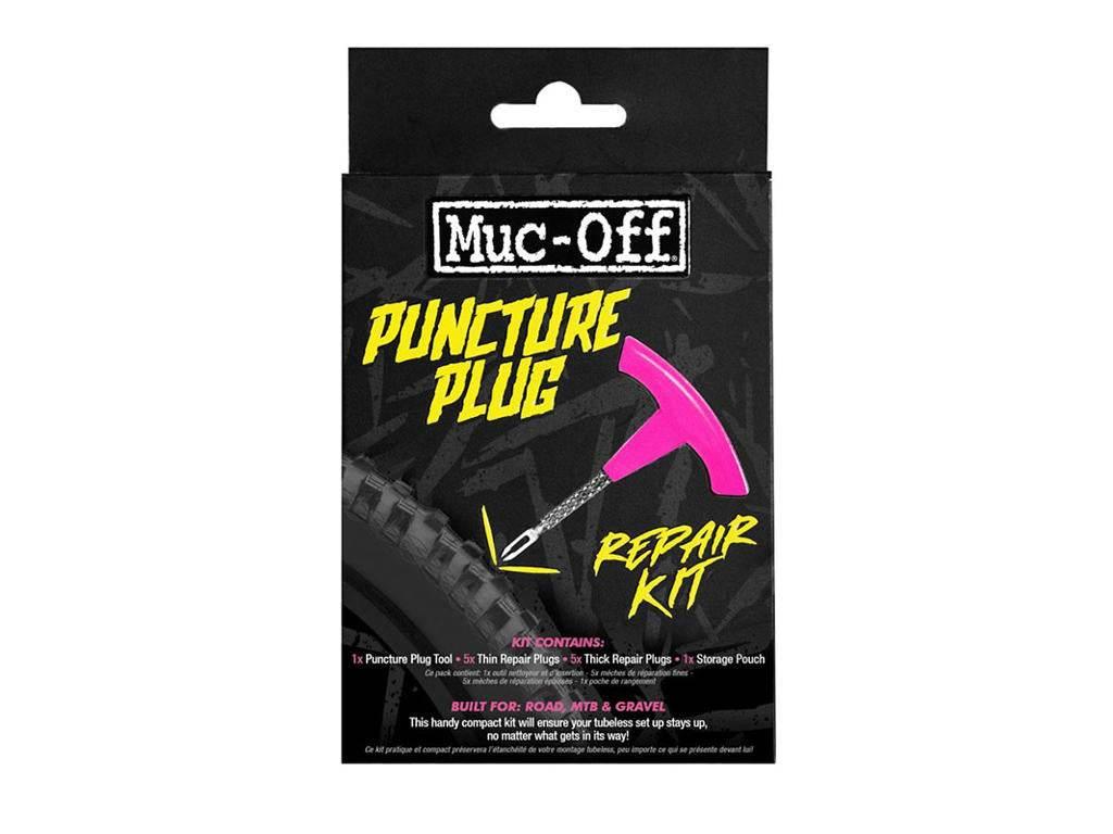 Muc-Off punkteringsplugg reparationskit med rosa handtag och text i starka gula färger