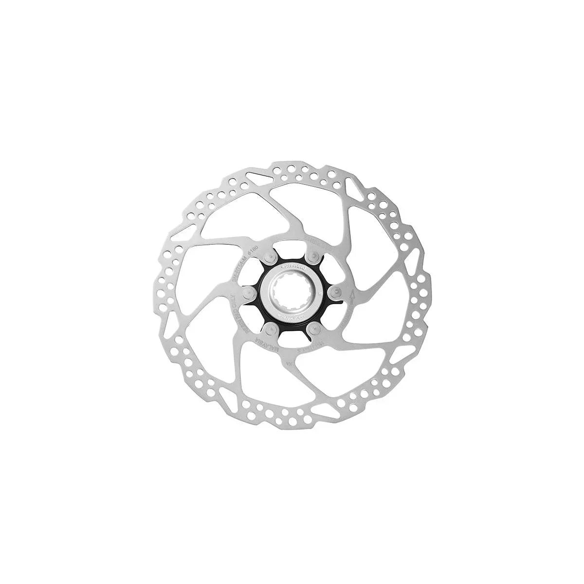 Silver och svart cykelbromsskiva i metall med perforerat mönster