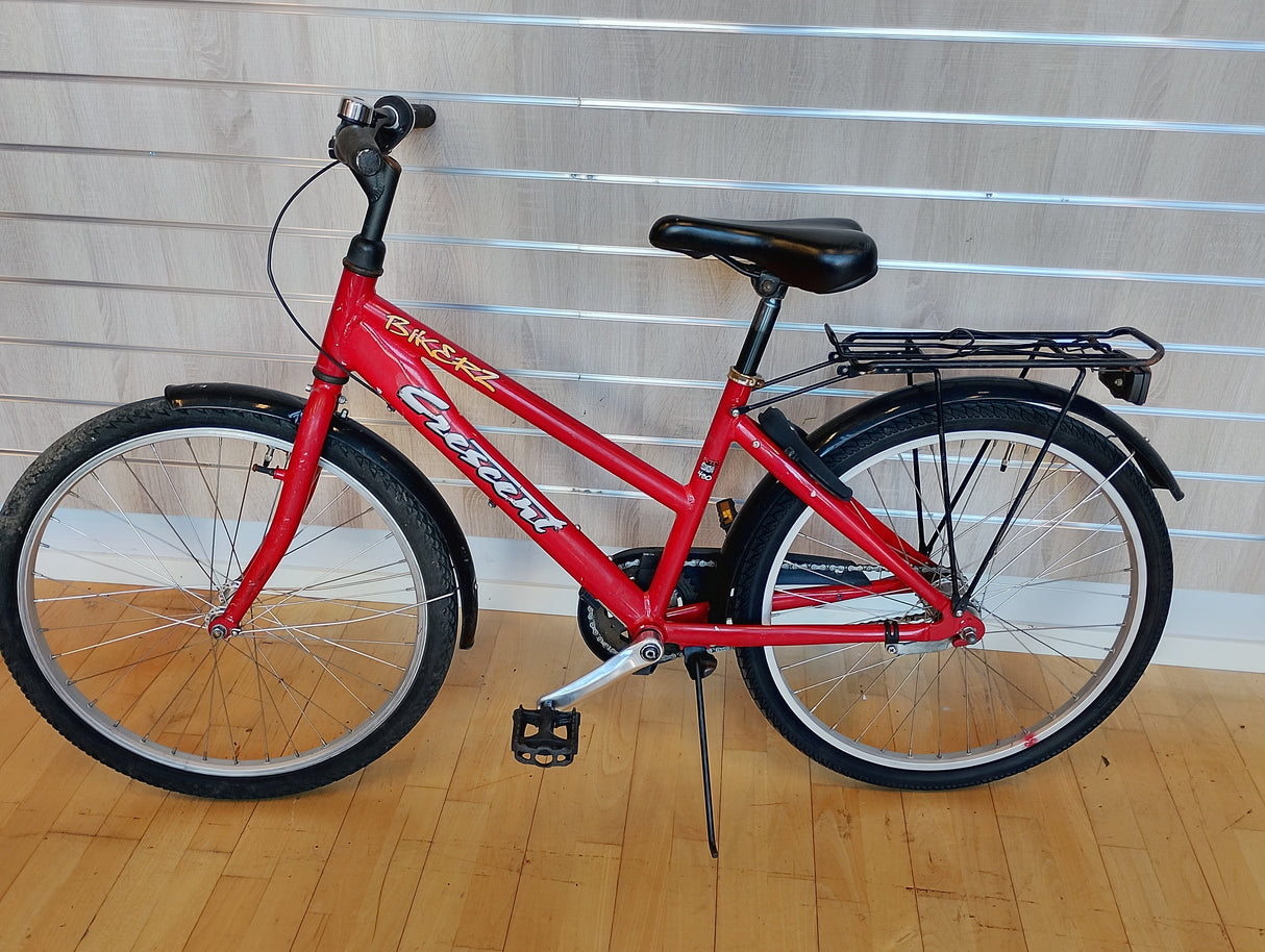 röd Crescent cykel med pakethållare, svart sadel och robust ram