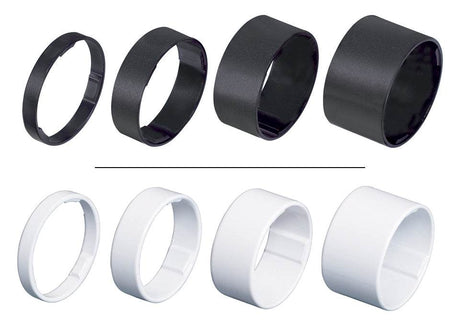 Fyra svarta och fyra vita distansringar i plast, olika storlekar, cykel tillbehör