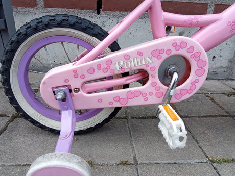 Barncykel Pollux rosa med rosa hjärtan, lila hjul och stödja med vit pedal
